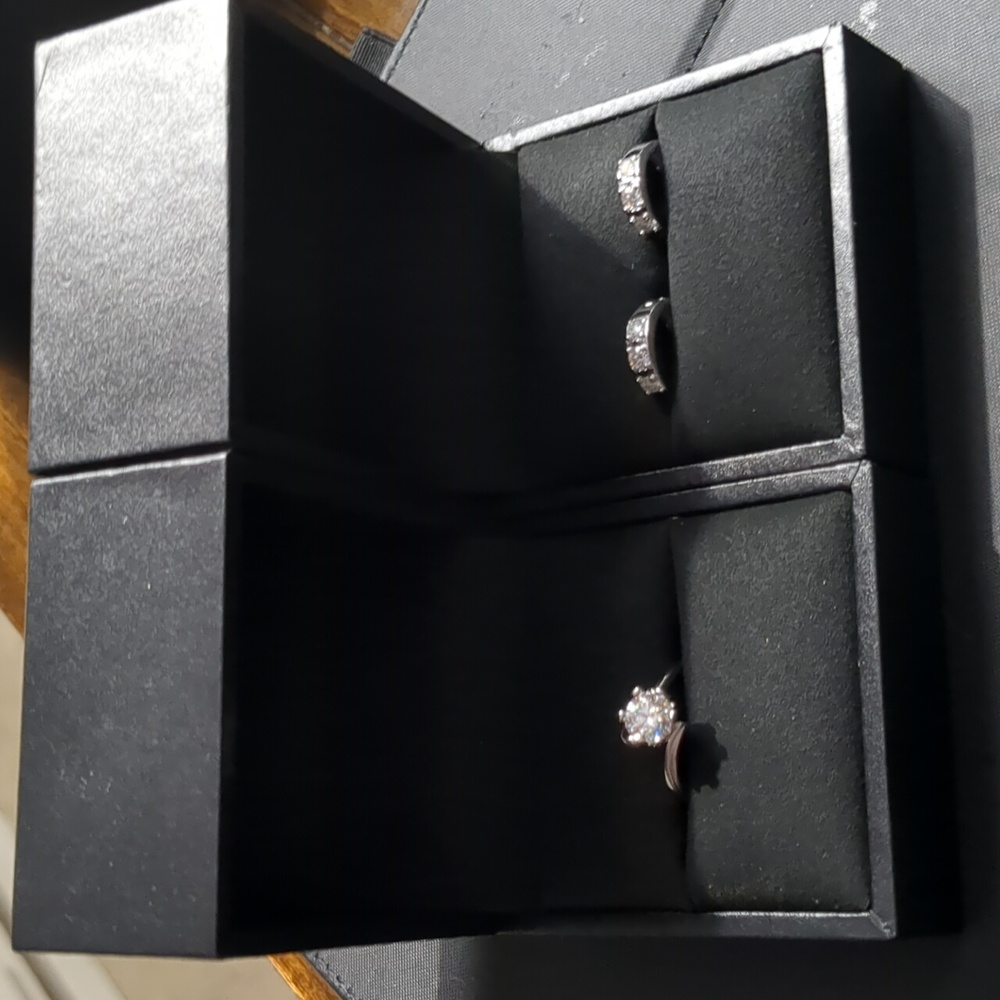 Francis Claire.85 carrot ring and .51 carat ear rings both have a certificate